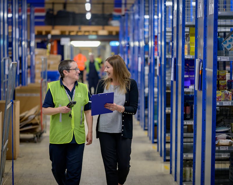 warehouse managers walking and talking